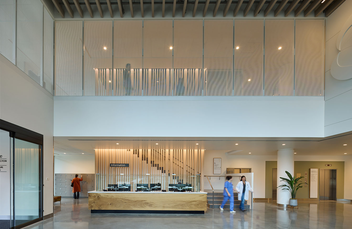 Image of the interior lobby space at the UW behavioral health teaching facility featuring the reception desk